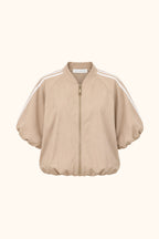A beige zip-up jacket with a stand collar, voluminous balloon sleeves, and white double stripes running along the shoulders, shown against a plain white background.