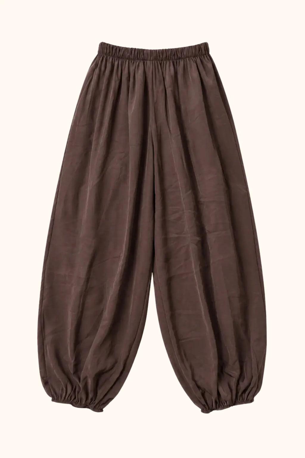 A pair of loose-fitting brown harem-style pants with an elastic waistband and gathered elastic cuffs at the ankles, shown against a plain white background.