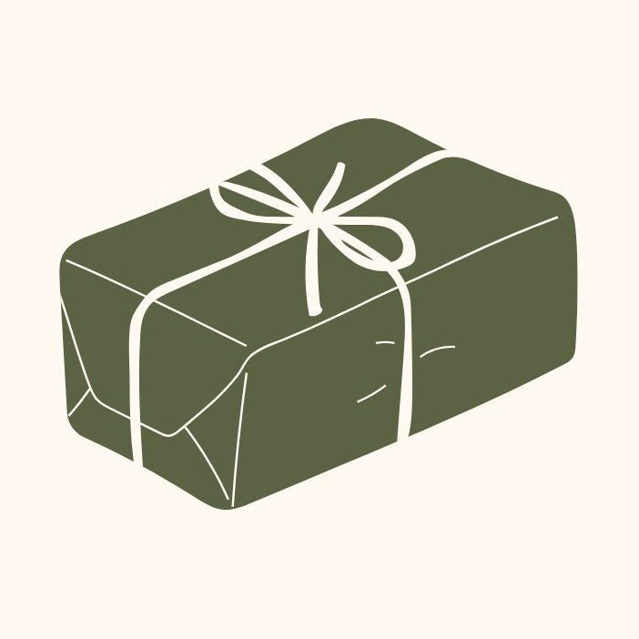 Green gift box with a white ribbon on a white background